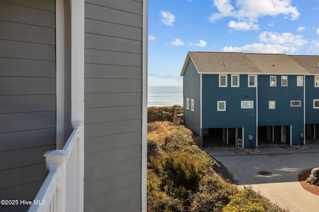 view of side of home featuring a water view