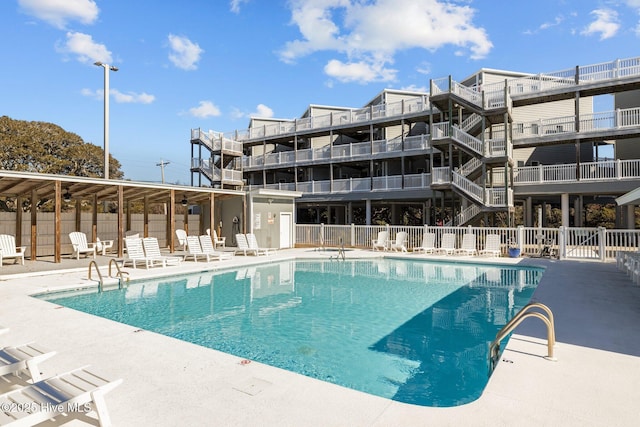 view of swimming pool featuring a patio area