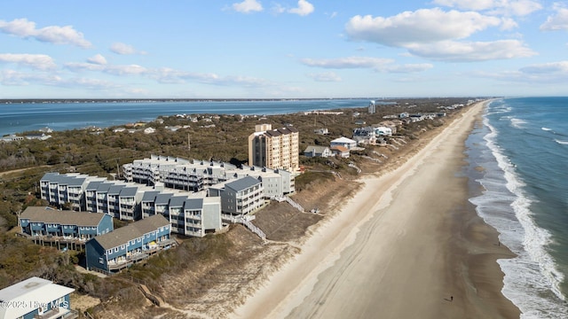 bird's eye view featuring a water view and a view of the beach