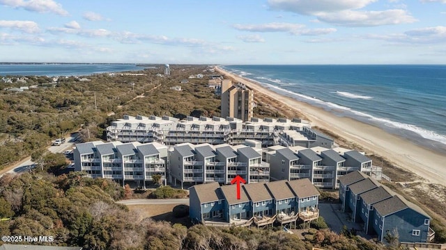 drone / aerial view with a water view and a view of the beach