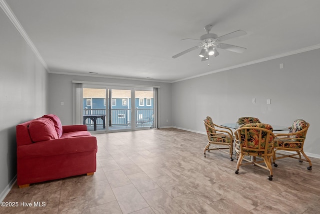 dining space with crown molding and ceiling fan