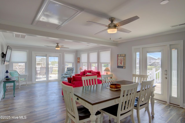 dining area with hardwood / wood-style flooring, ornamental molding, and ceiling fan