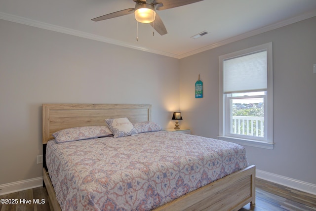 bedroom with ceiling fan, ornamental molding, and dark hardwood / wood-style floors