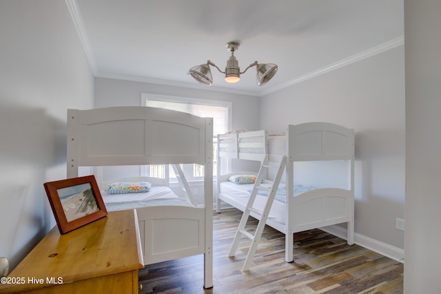 bedroom featuring ceiling fan, hardwood / wood-style floors, and crown molding