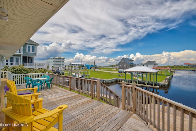 wooden deck featuring a gazebo and a water view