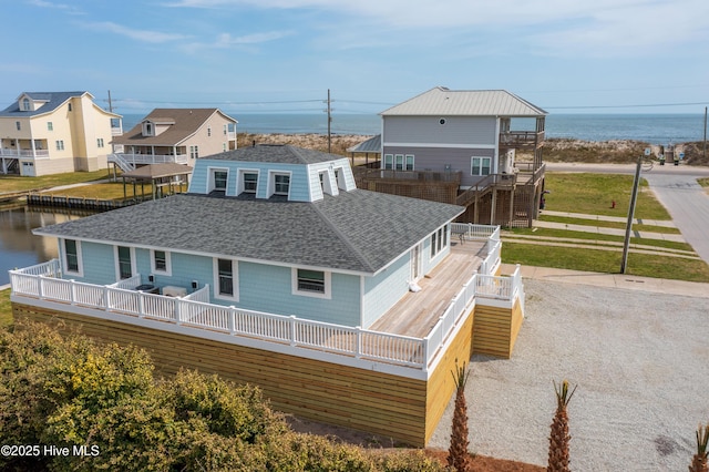 rear view of house with a water view