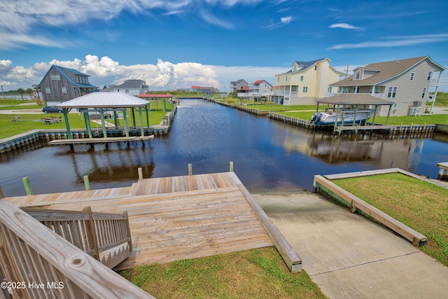 dock area with a gazebo and a water view