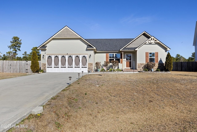 ranch-style house featuring a garage and a front lawn