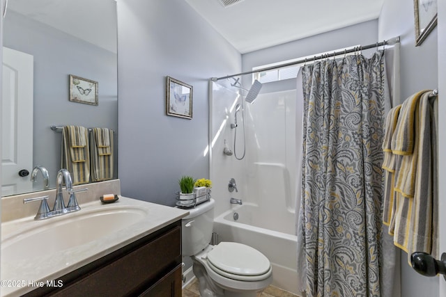 full bathroom featuring shower / tub combo with curtain, vanity, and toilet