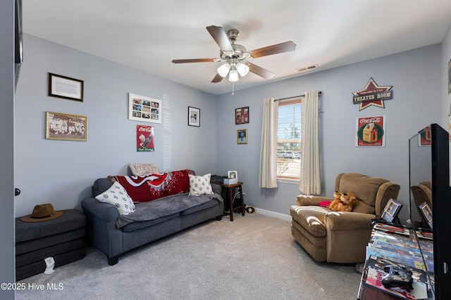 carpeted living room featuring ceiling fan