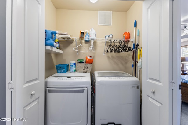 laundry area with separate washer and dryer