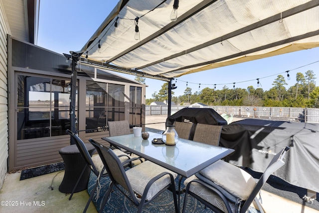 view of patio / terrace with a sunroom and grilling area