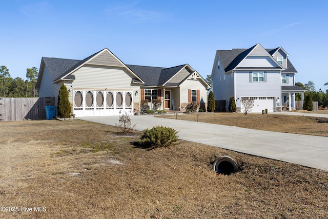 view of front of home with a garage and a front yard