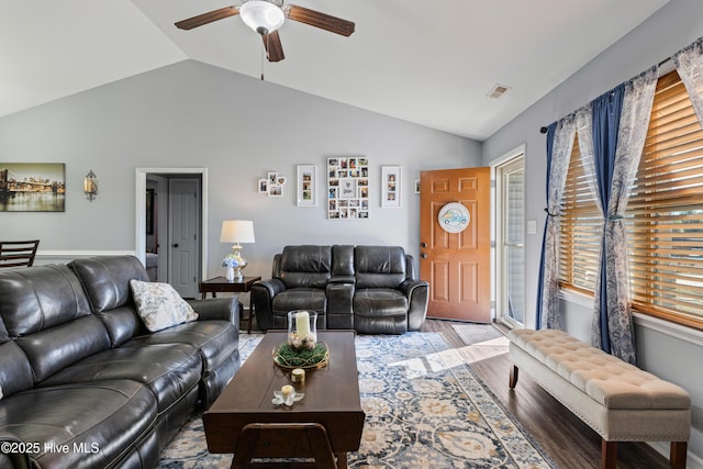 living room featuring lofted ceiling, hardwood / wood-style floors, and ceiling fan