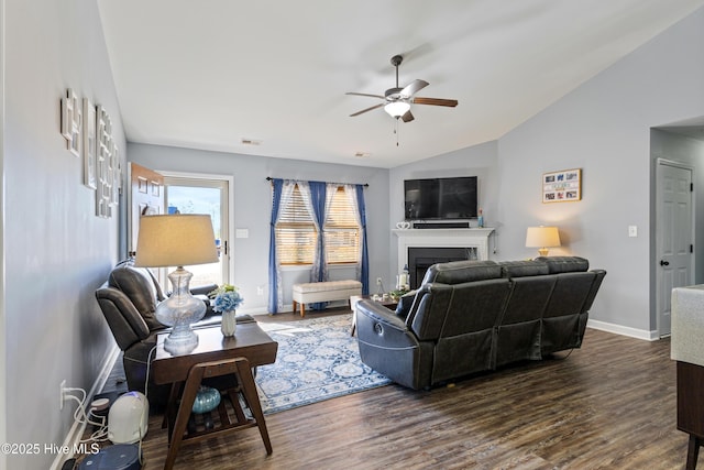 living room featuring lofted ceiling, dark hardwood / wood-style floors, and ceiling fan