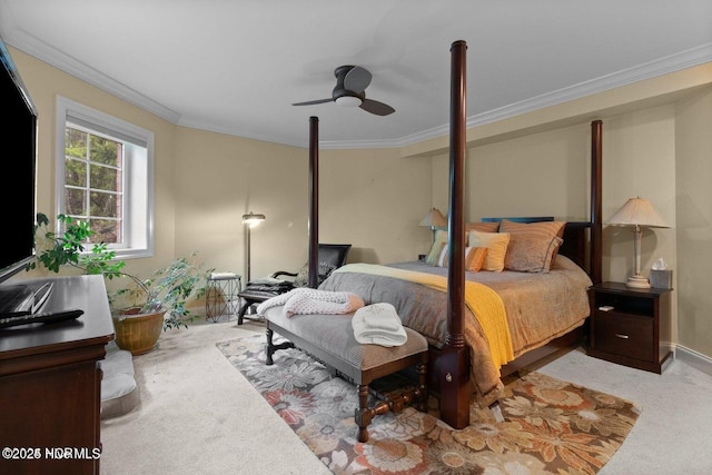 bedroom with ornamental molding, carpet, and ceiling fan