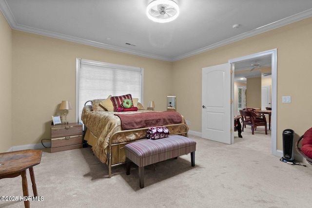 bedroom with ornamental molding, light colored carpet, and baseboards