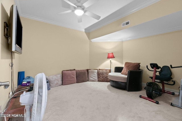 sitting room featuring ceiling fan, visible vents, baseboards, ornamental molding, and carpet