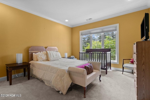 bedroom with light carpet, baseboards, visible vents, and crown molding