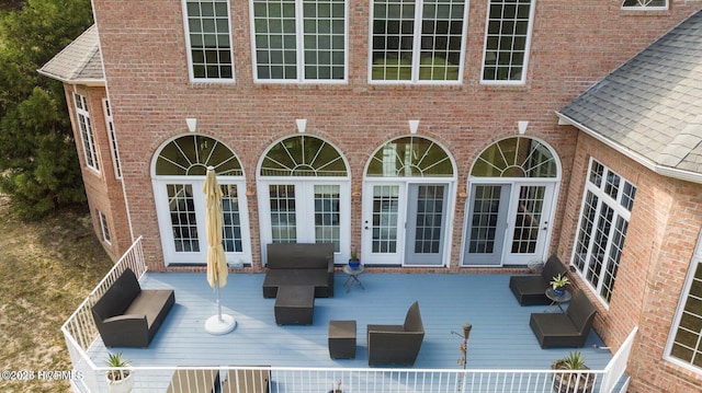 exterior space featuring french doors and a wooden deck