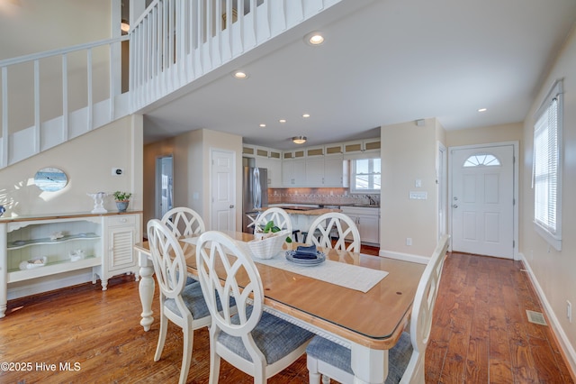 dining area featuring sink and light hardwood / wood-style flooring