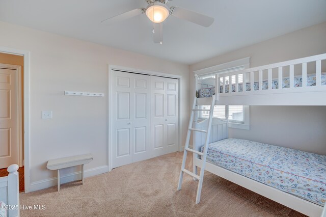 bedroom with light carpet and ceiling fan