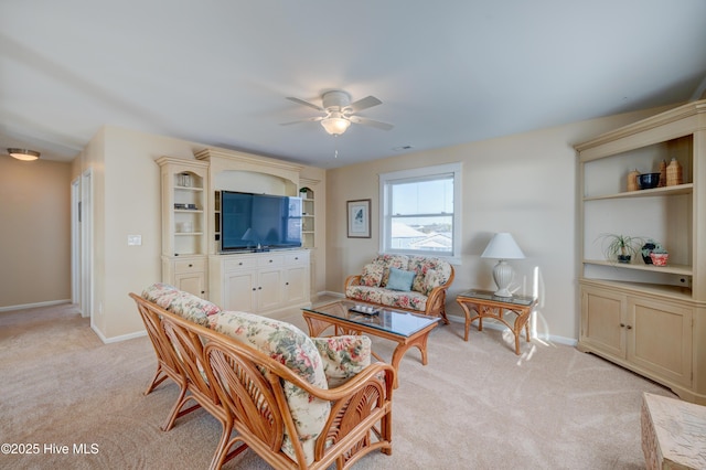 living room with ceiling fan and light carpet