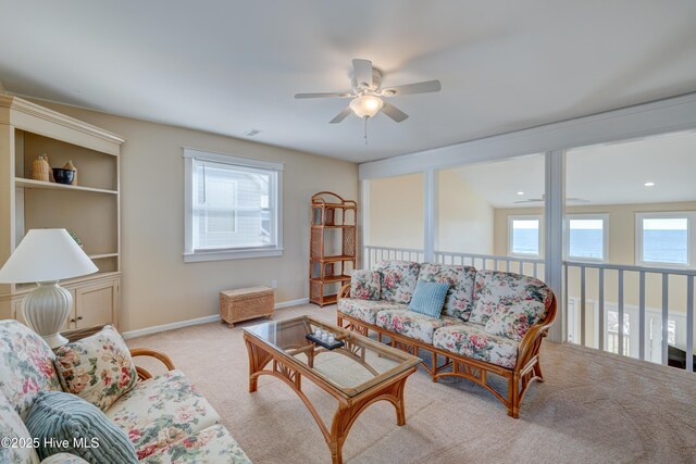 living room with hardwood / wood-style floors and a towering ceiling