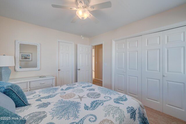 bedroom with ceiling fan and light carpet