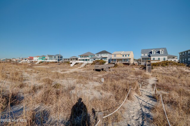 property view of water featuring a view of the beach