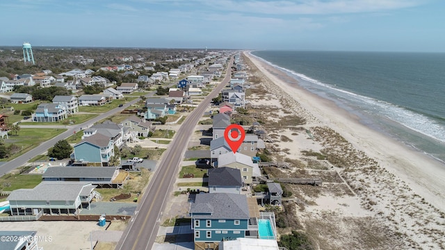 drone / aerial view featuring a view of the beach and a water view