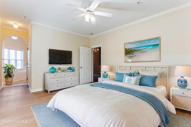 bedroom with crown molding, ceiling fan, and light wood-type flooring