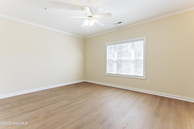 empty room with crown molding, ceiling fan, and light hardwood / wood-style flooring