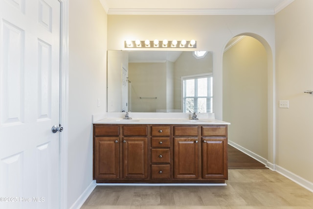 bathroom with vanity and ornamental molding