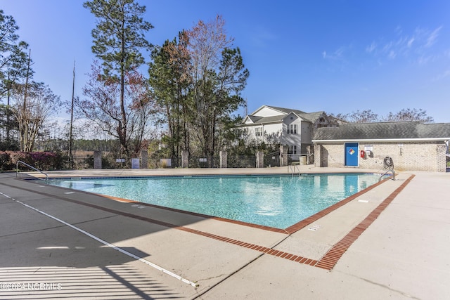 view of swimming pool featuring a patio area