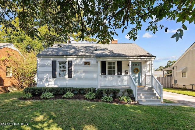 view of front of house with a porch and a front lawn