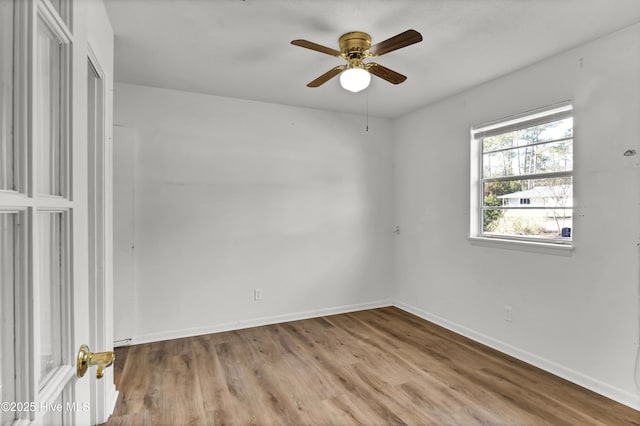 unfurnished room featuring ceiling fan and light hardwood / wood-style flooring