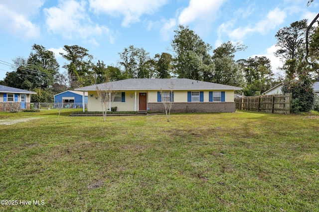 ranch-style home featuring a front yard