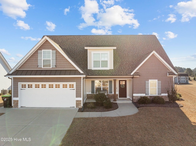 view of front of house with a garage and a porch