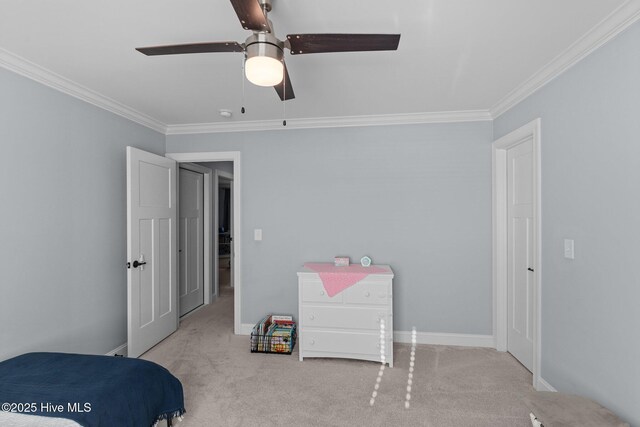 bedroom featuring ceiling fan, light colored carpet, and crown molding