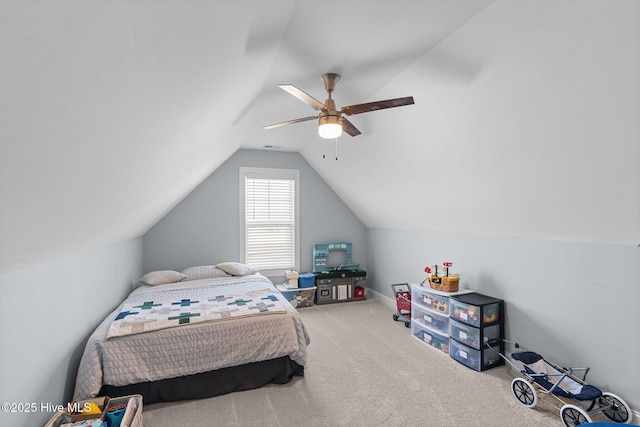 carpeted bedroom with lofted ceiling and ceiling fan