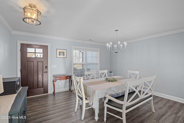 dining area with a chandelier, dark hardwood / wood-style floors, and ornamental molding