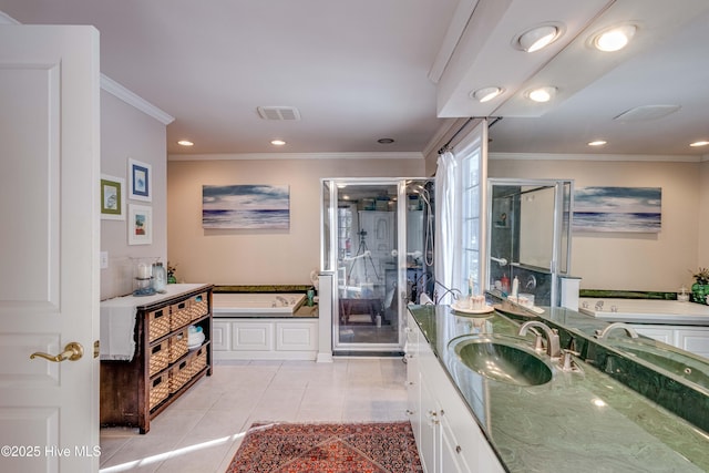 bathroom with tile patterned flooring, crown molding, separate shower and tub, and vanity
