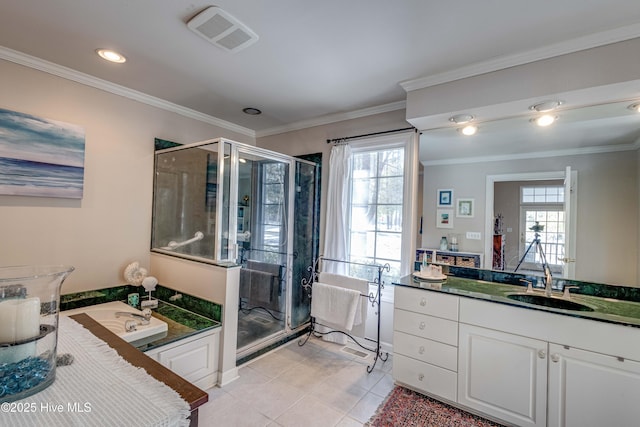 bathroom with tile patterned flooring, crown molding, shower with separate bathtub, and vanity