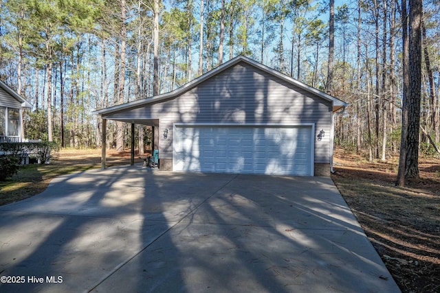 view of property exterior with an outbuilding and a garage