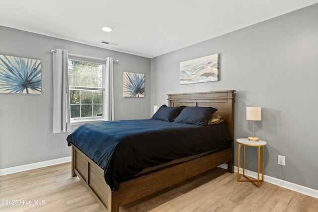 bedroom with light hardwood / wood-style floors