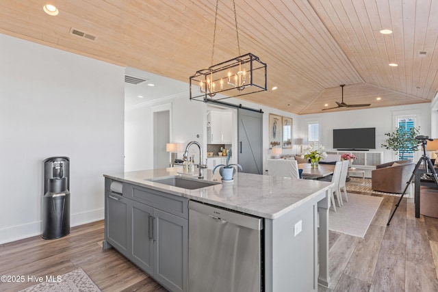 kitchen with hanging light fixtures, wood ceiling, a barn door, and dishwasher