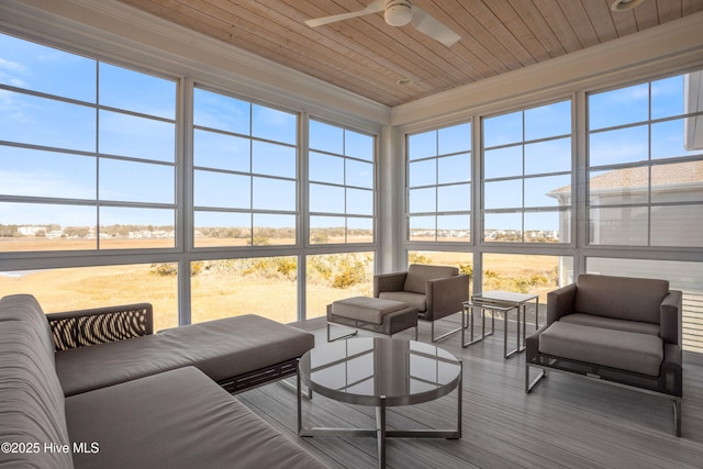 sunroom / solarium with wood ceiling and ceiling fan