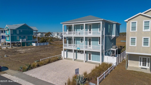 exterior space featuring a garage and a balcony