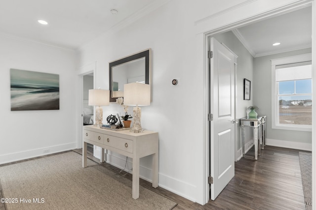 corridor with dark hardwood / wood-style flooring and crown molding